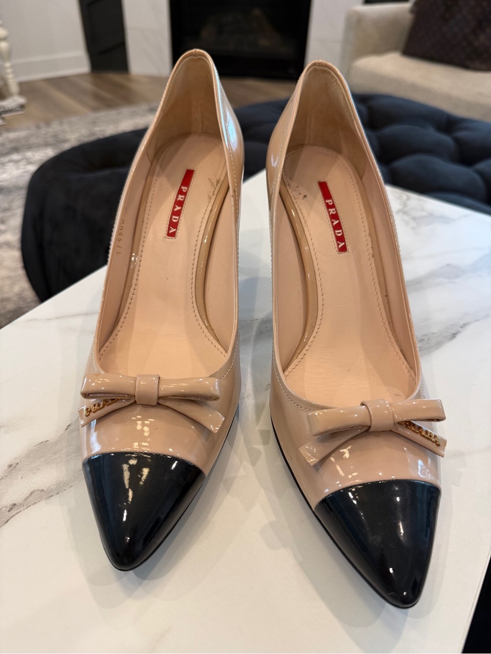 Prada Beige Patent Leather Pointed-Toe Pumps with Black Cap Toe and Bow